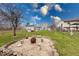 Large backyard featuring a fire pit, storage shed, and ample green space at 628 Southridge Ct, Westfield, IN 46074