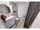 Charming bathroom featuring a modern vanity, decorative mirror, and stylish butterfly-themed wall decor at 628 Southridge Ct, Westfield, IN 46074