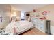 Cozy bedroom with a playful decor, featuring a comfortable bed, storage shelves, and a wall-mounted TV at 628 Southridge Ct, Westfield, IN 46074