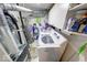 Functional laundry area with a washing machine, shelving, and necessary plumbing fixtures at 628 Southridge Ct, Westfield, IN 46074