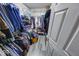 Spacious walk-in closet with metal shelving for clothing storage at 628 Southridge Ct, Westfield, IN 46074