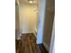 Bright bathroom featuring wood-style flooring, a shower-tub combo, and neutral-tone walls at 6417 E Clarks Hill Ct, Camby, IN 46113
