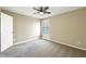 A cozy bedroom featuring a ceiling fan, window and plush carpet flooring at 643 Bracknell Dr, Avon, IN 46123