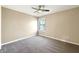 A serene bedroom featuring a ceiling fan, neutral walls, and plush carpet at 643 Bracknell Dr, Avon, IN 46123