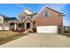 Charming two-story brick home with a stone entryway and attached two-car garage at 643 Bracknell Dr, Avon, IN 46123