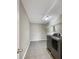 A functional laundry room equipped with a washer, dryer, and shelving for added convenience at 643 Bracknell Dr, Avon, IN 46123
