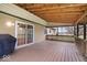 Spacious wooden back porch with a sliding glass door and a gas grill at 6602 Boston Ridge Ct, Indianapolis, IN 46237
