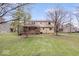 Spacious backyard with lush green grass and a view of the home's covered back porch at 6602 Boston Ridge Ct, Indianapolis, IN 46237