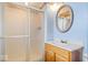 Small bathroom featuring a shower with sliding glass doors and a sink with a wooden vanity at 6602 Boston Ridge Ct, Indianapolis, IN 46237