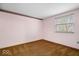 Plain bedroom featuring pink walls, wall-to-wall carpet, and natural light from a single window at 6602 Boston Ridge Ct, Indianapolis, IN 46237