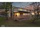 Charming two-story home with a covered back porch, chimney, and a well-maintained lawn at dusk at 6602 Boston Ridge Ct, Indianapolis, IN 46237