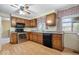 Well-equipped kitchen featuring stainless steel appliances, wooden cabinets and wood flooring at 6602 Boston Ridge Ct, Indianapolis, IN 46237