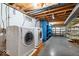Modern laundry room featuring a washer and dryer and metal shelving for storage at 6602 Boston Ridge Ct, Indianapolis, IN 46237