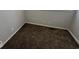 Carpeted bedroom with neutral walls and base trim at 709 S Vine St, Muncie, IN 47302