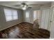 Bright bedroom with attractive wood flooring, neutral walls, and ample closet space at 709 S Vine St, Muncie, IN 47302