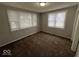 Bedroom with carpeted floors and natural light at 709 S Vine St, Muncie, IN 47302