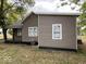 The exterior of this home has a neutral siding, complementing the surrounding landscape at 709 S Vine St, Muncie, IN 47302