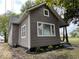 The exterior of the home boasts neutral siding, large windows, and a welcoming front porch at 709 S Vine St, Muncie, IN 47302