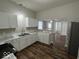 Modern kitchen featuring white cabinets, stylish countertops, and stainless steel appliances at 709 S Vine St, Muncie, IN 47302