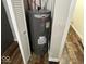 Rheem water heater in a utility closet, for on-demand hot water at 709 S Vine St, Muncie, IN 47302