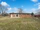 The home's backyard offers a large grassy area and patio, providing plenty of space for outdoor living at 7224 Rose Dr, Indianapolis, IN 46227