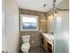 Stylish bathroom featuring a modern vanity, updated tile, and a glass-enclosed shower for a spa-like experience at 7224 Rose Dr, Indianapolis, IN 46227