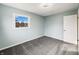 Bedroom with carpet and neutral walls, window and closet at 7224 Rose Dr, Indianapolis, IN 46227