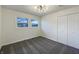 Bright bedroom featuring carpet floors and spacious closet at 7224 Rose Dr, Indianapolis, IN 46227