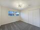 Bright bedroom with large windows, neutral carpet, and ample closet space, ready for personalization at 7224 Rose Dr, Indianapolis, IN 46227