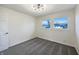 Comfortable bedroom with carpet flooring and view of backyard at 7224 Rose Dr, Indianapolis, IN 46227