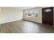 Bright, airy living room with hardwood floors and large windows. Ideal space to create your dream aesthetic at 7224 Rose Dr, Indianapolis, IN 46227