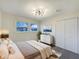 Cozy main bedroom showcasing neutral decor, soft carpet, and natural light, perfect for relaxation at 7224 Rose Dr, Indianapolis, IN 46227