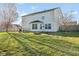 Spacious backyard featuring a patio dining set, fire pit, and plenty of room for outdoor enjoyment at 76 Wyndham Ln, Brownsburg, IN 46112