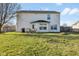 Large backyard with a patio dining set, fire pit, and ample space for outdoor activities and gatherings at 76 Wyndham Ln, Brownsburg, IN 46112