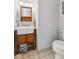A bathroom sink, toilet, and wood cabinet at 76 Wyndham Ln, Brownsburg, IN 46112
