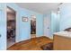 A bathroom with blue walls and a wood floor at 76 Wyndham Ln, Brownsburg, IN 46112