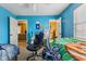 Bedroom with bright blue walls, ceiling fan, and natural light at 76 Wyndham Ln, Brownsburg, IN 46112