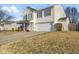 Inviting two-story home with a spacious driveway, attached garage, and well-kept lawn at 76 Wyndham Ln, Brownsburg, IN 46112