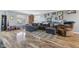 Cozy living room with hardwood floors, comfortable seating, and ample natural light at 76 Wyndham Ln, Brownsburg, IN 46112