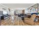 Inviting living room with wood floors, TV, comfortable sofa, and a neutral color scheme at 76 Wyndham Ln, Brownsburg, IN 46112