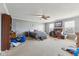 A spacious main bedroom with carpet and ceiling fan at 76 Wyndham Ln, Brownsburg, IN 46112