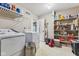 A pantry with shelves and a washer and dryer at 76 Wyndham Ln, Brownsburg, IN 46112