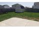 Large backyard featuring a storage shed and ample green space, ideal for outdoor activities at 7835 E 296Th St, Atlanta, IN 46031