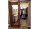 Bright bathroom with wood-look flooring, white vanity, and closet with sliding door at 7835 E 296Th St, Atlanta, IN 46031