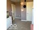 bedroom with two doors, playful wall decor, and neutral carpet at 7835 E 296Th St, Atlanta, IN 46031