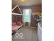A cozy bedroom featuring plush decor, light-filtering curtains, and neutral gray carpet at 7835 E 296Th St, Atlanta, IN 46031