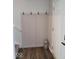 Welcoming entryway features a coat rack, a decorative lantern, and durable wood-look flooring at 7835 E 296Th St, Atlanta, IN 46031
