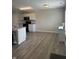 Modern kitchen with granite countertops, stainless appliances, a kitchen island, and beautiful flooring at 7835 E 296Th St, Atlanta, IN 46031