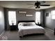 Calm main bedroom with a king bed, dark furniture, and neutral color scheme at 7835 E 296Th St, Atlanta, IN 46031