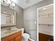Clean bathroom features a vanity with drawers, tile flooring, and access to the walk-in closet at 851 Pine Lake Dr, Greenwood, IN 46143